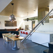 View of kitchen designed by Tim Rempel of architecture, ceiling, countertop, daylighting, floor, glass, house, interior design, kitchen, loft, stairs, table