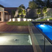 View of outdoor living space by Nathan Burkett architecture, backyard, estate, home, house, lighting, property, real estate, reflection, swimming pool, water, black