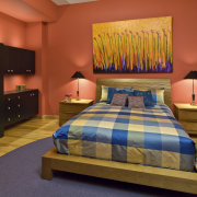 View of bedroom featuring bed with blue and bed, bed frame, bed sheet, bedroom, ceiling, home, interior design, real estate, room, suite, wall, red