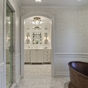 View of a traditional-styled bathroom which features a ceiling, estate, floor, flooring, home, interior design, room, tile, wall, window, gray