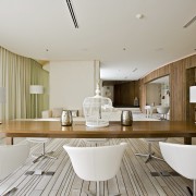 View of the executive lounge featuring bleached wood architecture, ceiling, interior design, living room, real estate, table, gray