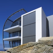 Exterior view of a Sydney apartment building which architecture, building, facade, house, real estate, sky, blue