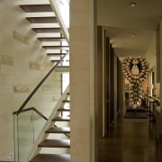 View of stairway with dark-stained timber steps, glass baluster, floor, flooring, handrail, home, interior design, stairs, structure, wood, brown