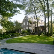 View of this traditional house from a distance backyard, cottage, estate, grass, historic house, home, house, landscape, landscaping, lawn, mansion, neighbourhood, plantation, property, real estate, residential area, suburb, tree, yard, green