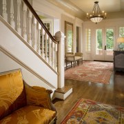 Interior view of this traditional home. Featuring the ceiling, estate, floor, flooring, hardwood, home, house, interior design, laminate flooring, living room, property, real estate, room, wall, window, wood, wood flooring, brown, orange