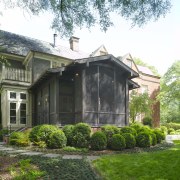 Exterior view of this traditional entrance way - backyard, cottage, estate, farmhouse, garden, historic house, home, house, landscape, landscaping, outdoor structure, property, real estate, siding, tree, yard, white