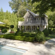 Overview of main outdoor living area features pool, backyard, cottage, estate, home, house, landscape, landscaping, mansion, neighbourhood, plant, property, real estate, residential area, suburb, tree, villa, yard, brown