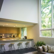 View of contemporary kitchen from the living room. architecture, ceiling, daylighting, home, house, interior design, living room, real estate, window, gray