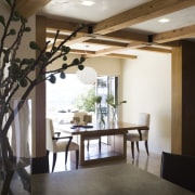 Ranch-style kitchen by Applegate Tran Interiors - Ranch-style architecture, beam, ceiling, daylighting, dining room, floor, flooring, furniture, home, house, interior design, living room, room, table, wood, black, white