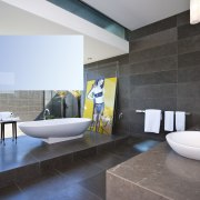 View of bathroom which features a freestanding tub architecture, bathroom, floor, flooring, interior design, product design, room, tile, gray, black