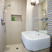 View of outdoor place in a Wanaka holiday bathroom, bathroom accessory, bathroom sink, interior design, plumbing fixture, product design, property, room, sink, tap, toilet, toilet seat, gray