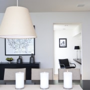 View of dining area which features a black ceiling, furniture, home, interior design, light fixture, lighting accessory, living room, product design, table, gray, white