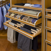 View of closet cabinetry designed and built by closet, floor, flooring, furniture, product, room, wood, brown