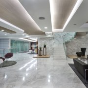 White marble was introduced for the flooring to architecture, ceiling, daylighting, floor, flooring, interior design, lobby, real estate, gray