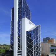 The new Menara Bumiputra Commerce tower is appropriate architecture, building, commercial building, condominium, corporate headquarters, daytime, facade, headquarters, metropolitan area, mixed use, sky, skyscraper, tower block, blue