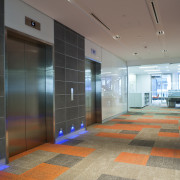 View of the elevator lobby at the Deloitte architecture, ceiling, floor, flooring, glass, interior design, lobby, real estate, black