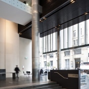 Interior view of the Deloitte Centre offices which architecture, building, ceiling, daylighting, floor, glass, interior design, lobby, structure, gray, black