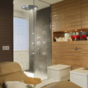 View of bathroom which features shower enclosure, lounger, architecture, bathroom, ceiling, floor, interior design, room, brown