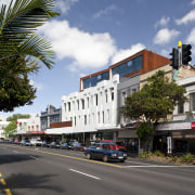 Exterior view of the Ironbank building which features arecales, building, car, city, condominium, downtown, home, house, infrastructure, metropolitan area, mixed use, neighbourhood, palm tree, plant, real estate, residential area, road, sky, street, town, tree, urban area, woody plant