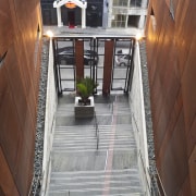 View of fire escape stairways at the Ironbank architecture, floor, flooring, handrail, house, property, stairs, window, wood, red, gray