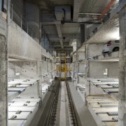 View of the car-stacking parking system in the public transport, track, gray, black