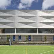 Exterior view of the St Kents' Jubilee Sports architecture, building, corporate headquarters, daylighting, daytime, elevation, facade, grass, headquarters, house, real estate, roof, sky, sport venue, structure, window, gray