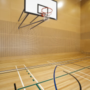 Interior view of the gymnasium of the St basketball court, floor, flooring, hardwood, leisure centre, net, sport venue, sports, structure, table, wood, orange