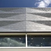 Exterior view of St Kents' Jubilee Sports Centre architecture, building, commercial building, condominium, corporate headquarters, daylighting, daytime, elevation, facade, glass, headquarters, line, reflection, roof, sky, structure, window, gray