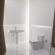 View of a high-end bathroom which features a bathroom, bathroom accessory, bathroom cabinet, bathroom sink, bidet, ceramic, floor, plumbing fixture, product design, shelf, sink, tap, tile, toilet seat, wall, gray