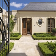 Overview of the entrance of this home - courtyard, estate, facade, home, house, landscaping, property, real estate, residential area, walkway, window, yard