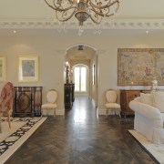 View of the hallway moving into the living ceiling, estate, floor, flooring, home, interior design, living room, property, real estate, room, wall, wood flooring, gray, brown