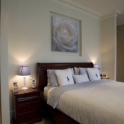 View of a bedroom with ensuite which features bed, bed frame, bedroom, ceiling, furniture, home, hotel, interior design, real estate, room, suite, window, gray, brown