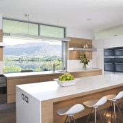 View of a contemporary kitchen which features appliances architecture, countertop, interior design, kitchen, real estate, white