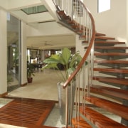 Interior view of a self sustainable house designed apartment, balcony, daylighting, estate, floor, flooring, handrail, hardwood, home, house, interior design, property, real estate, stairs, wood, brown, orange
