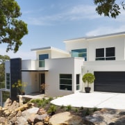 Exterior view of contemporary home designed and built architecture, elevation, facade, home, house, property, real estate, white