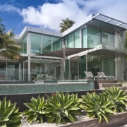 View of a pool area which features glass architecture, arecales, condominium, estate, facade, home, house, mixed use, palm tree, property, real estate, resort, villa