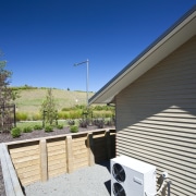 Exterior view of David Reid show home which architecture, daylighting, facade, home, house, property, real estate, residential area, roof, siding, sky, window, blue, white