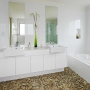 View of bathroom which features pebble stone floors, bathroom, bathroom accessory, bathroom cabinet, countertop, floor, flooring, home, interior design, room, sink, tile, wall, wood flooring, gray, white