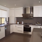 view of the kitchen in a home built cabinetry, countertop, cuisine classique, interior design, kitchen, property, real estate, room, gray