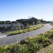 Exterior view of landscaped area surrounding the Ferndale estate, home, house, land lot, landscape, plant, real estate, residential area, sky, suburb, tree, village, water