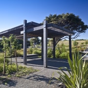 Exterior view of landscaped area surrounding the Ferndale cottage, estate, home, house, landscape, outdoor structure, pergola, plant, property, real estate, sky
