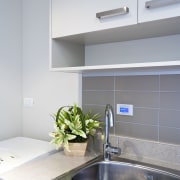 View of the touch-button keypad that controls the bathroom, countertop, interior design, kitchen, room, sink, tap, gray