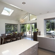 View of the open-plan kitchen area in a countertop, daylighting, estate, home, house, interior design, kitchen, property, real estate, window, gray