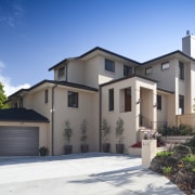 Exterior view of a home designed by Town building, elevation, estate, facade, home, house, neighbourhood, property, real estate, residential area, sky, villa