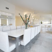 View of dining area which features tiled floors, architecture, floor, furniture, interior design, table, gray
