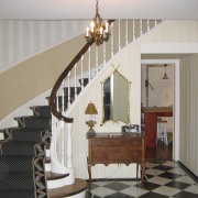 View of the stairway in this traditional house baluster, ceiling, floor, flooring, handrail, home, interior design, real estate, room, stairs, wall, gray