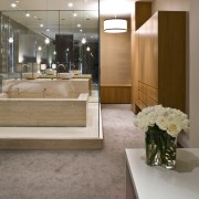 View of contemporary bathroom with mirror wall, white architecture, ceiling, floor, flooring, interior design, lobby, gray, brown