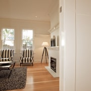View of beachfront house with courtyard, formal living ceiling, floor, flooring, hardwood, home, house, interior design, laminate flooring, living room, molding, real estate, room, wall, window, wood, wood flooring, orange, gray