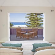 View of beachfront house with courtyard, formal living bedroom, estate, home, house, interior design, living room, property, real estate, room, suite, window, wood, gray