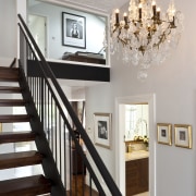 Close up of stairway &amp; chandelier - Close baluster, ceiling, dining room, floor, flooring, handrail, hardwood, home, house, interior design, light fixture, molding, room, stairs, wall, wood, gray